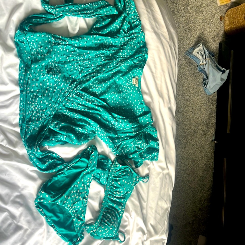 This is a set swimsuit and a wrap around shirt been worn a few times